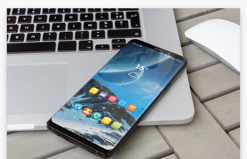 smartphone-on-laptop-mockup-psd